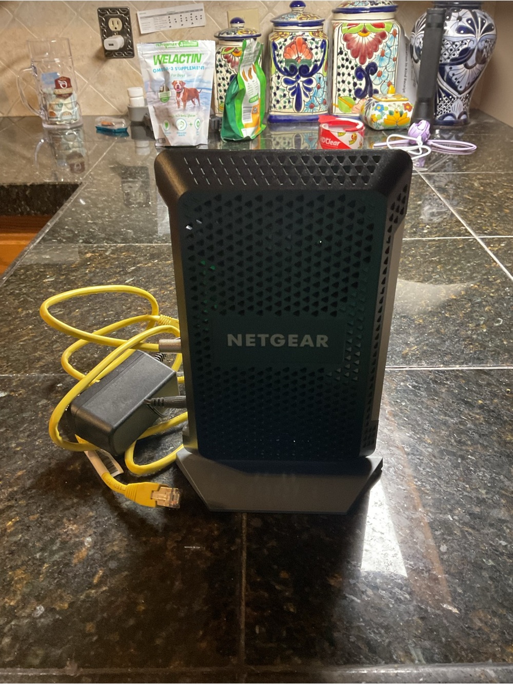 NETGEAR Black Cable Modem/Router with Yellow Ethernet Cable